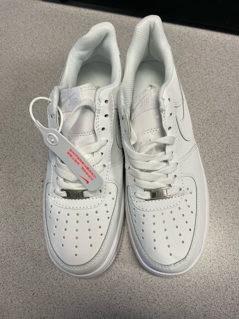 Nike All-White Leather Low-Top Sneakers